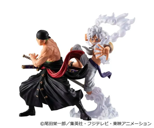 MegaHouse WALLSTAR One Piece figures: Roronoa Zoro in a black coat and bandana drawing a sword, and Monkey D. Luffy in Gear 5 with white hair and clothes surrounded by white cloud effects, product photo